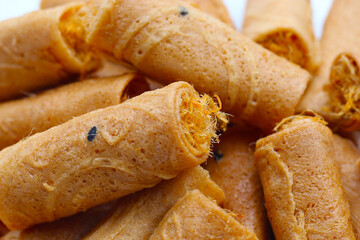Rolled crispy wafers filled with shredded pork floss, Thai snack.