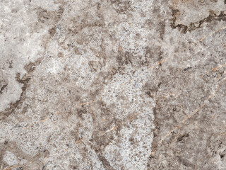 Beautiful textured stone surface showing natural patterns and colors found in a quarry during daytime