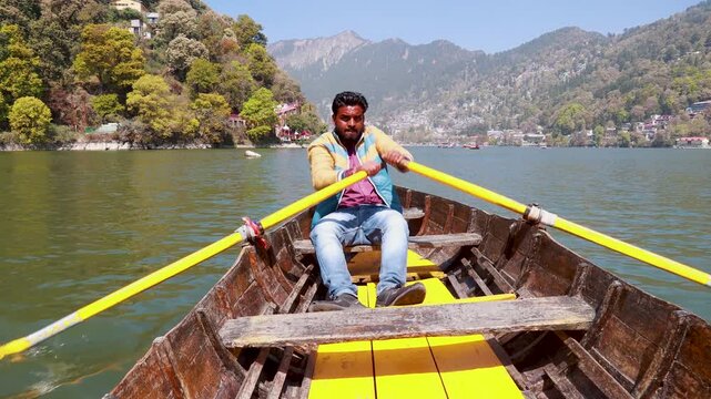 Close-Up of Man Rowing Boat Paddle in Nainital Lake, India