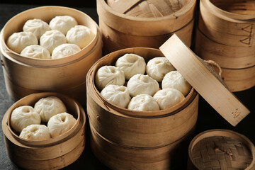 Traditional Chinese Baozi Dumplings with Meat in Bamboo Steamers - Authentic Dim Sum Breakfast