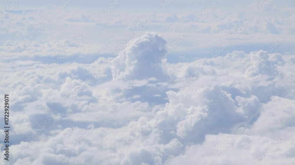 Poster white clouds visible from distance , pov from a plane window