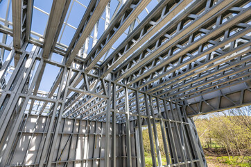 Light gauge steel framing system used for house construction. Wall to be clad with fibre cement board. Metal frame of newly built building. Construction of a new tiny house