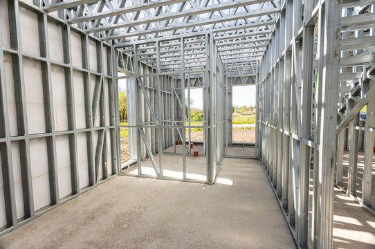 Light gauge steel framing system used for house construction. Wall to be clad with fibre cement board. Metal frame of newly built building. Construction of a new tiny house