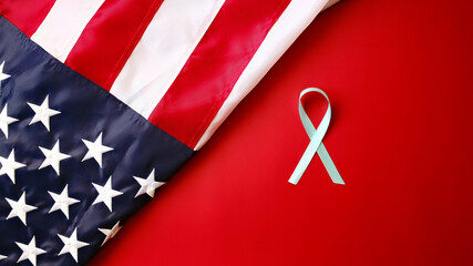 A light blue ribbon on a red background with an American flag for Prostate Cancer Awareness Month...