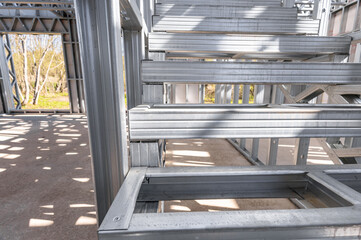 Obraz premium Steel frame commercial building under construction. The steel girder framework of a new building