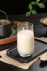 Fresh Corn Germ Milk Drink in Glass on Rustic Wooden Table with Natural Ingredients