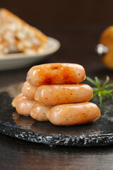 Grilled Crispy Sausages Stack on Slate Board - Delicious Main Course Food Picture