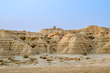 Eroded Sedimentary Rock Formations In Bardenas Reales Natural Park Spain. Badlands landscape, stratified cliffs, semi desert, geological wonder