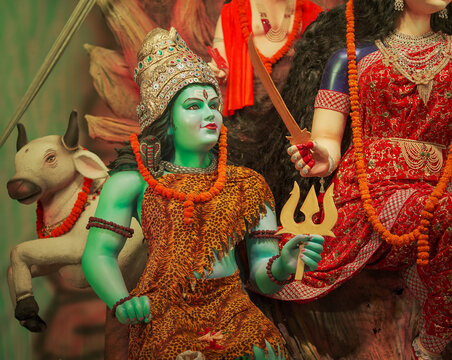 Shiv Parvati idol in divine form, Hindu goddess Durga with Shiva statue, Traditional Navratri festival decoration, Artistic sculpture of Shiv and Shakti stock photo.