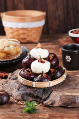 Traditional Chinese Water Chestnuts and Red Dates Tea Time Still Life on Wooden Table