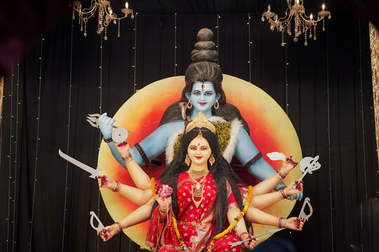 Shiv Parvati idol in divine form, Hindu goddess Durga with Shiva statue, Traditional Navratri festival decoration, Artistic sculpture of Shiv and Shakti stock photo.