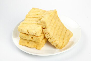 Dried Tofu Sticks on White Plate - Traditional Asian Bean Curd Food Ingredient