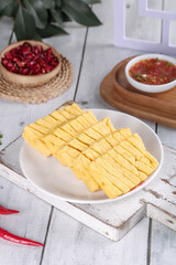 Dried Tofu Skewers on White Plate - Asian Food Photography Studio Shoot with Dipping Sauce