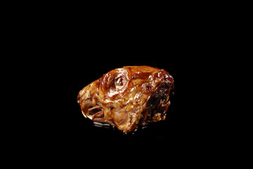 Shuangliu Marinated Rabbit Head Traditional Chinese Dish with Spices and Oil on Black Background