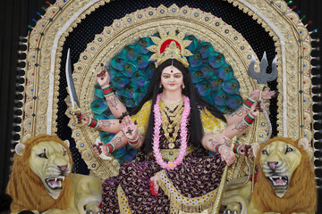 Goddess Durga with lion statue, Hindu goddess Durga idol, Navratri festival Durga maa, Divine Durga mata sculpture stock photo.