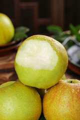 Fresh Ripe Pears with Water Drops - One Peeled Showing Juicy White Flesh on Wooden Background