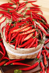 Fresh Red Chili Peppers in Rustic Basket - Spicy Cooking Ingredients