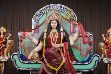 Goddess Durga with lion statue, Hindu goddess Durga idol, Navratri festival Durga maa, Divine Durga mata sculpture stock photo.