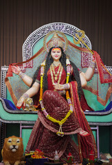 Goddess Durga with lion statue, Hindu goddess Durga idol, Navratri festival Durga maa, Divine Durga mata sculpture stock photo.