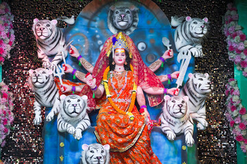 Goddess Durga with lion statue, Hindu goddess Durga idol, Navratri festival Durga maa, Divine Durga mata sculpture stock photo.