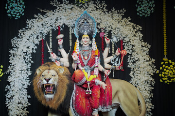Goddess Durga with lion statue, Hindu goddess Durga idol, Navratri festival Durga maa, Divine Durga mata sculpture stock photo.