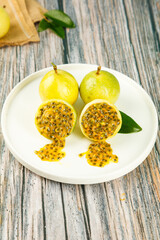 Fresh Passion Fruit Halves with Seeds on White Plate - Tropical Fujian Fruit