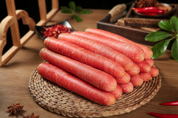 Fresh Sichuan Shawo Red Carrots on Woven Basket with Traditional Chinese Spices and Herbs