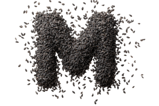 Capital letter "M" formed from black seeds, with scattered seeds