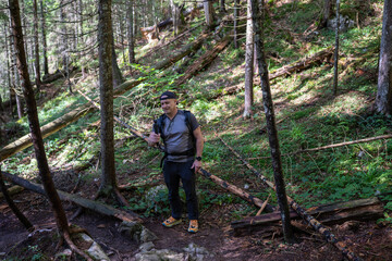Hiker filming on forest trail