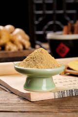 Fresh Ginger Powder Spice in Green Bowl on Wooden Board - Kitchen Seasoning for Cooking and Barbecue Recipes