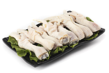 Fresh Raw Chicken Wings and Claws on Black Tray with Lettuce for Cooking