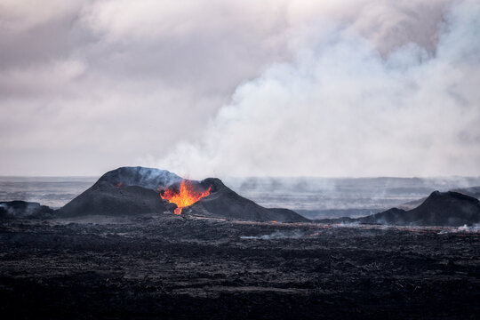 Dramatic volcanic eruption with fiery lava at Sundhn�kag�gar in Iceland