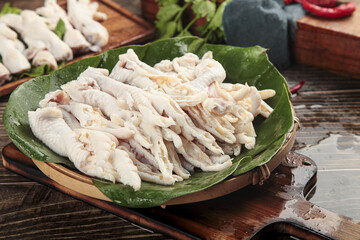 Fresh Boneless Chicken Feet Claws on Banana Leaf Traditional Asian Cuisine Delicacy