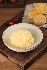 Traditional Chinese White Silver Ear Fungus Soup Dessert in Ceramic Bowl on Wooden Serving Tray