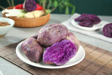 Purple Vietnamese Sweet Potatoes with Violet Flesh on White Plate - Healthy Organic Root Vegetables