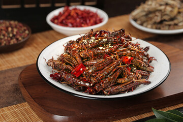 Shandong Style Dry Stir-Fried Grasshoppers with Fresh Chili Seeds - Traditional Chinese Insect Delicacy Picture