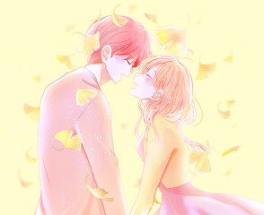 向かい合ってい笑う男女　秋　イチョウ