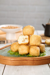Handmade Golden Fried Tofu Cubes Traditional Asian Cuisine on Wooden Serving Plate