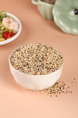 Mixed Tricolor Quinoa Grains in White Bowl - Healthy Superfood Ingredient for Nutritious Meals