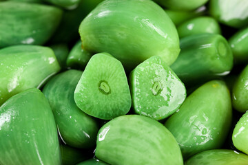 Fresh Green Olives with Water Droplets - Whole and Cut Halves Close-Up