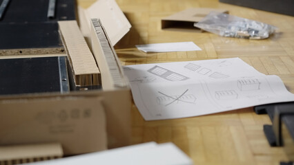 Pile of just unpacked elements of a new cabinet furniture ready for assembling