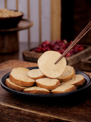 Sliced Tofu with Chopsticks on Black Plate - Traditional Asian Vegetarian Food
