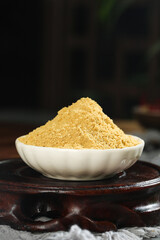Fresh Ground Ginger Powder in White Bowl - Healthy Yellow Spice Seasoning for Cooking and Natural Medicine