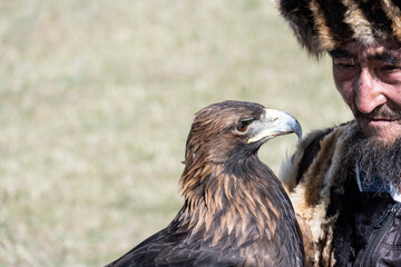 A Mongolian eagle hunter, a berkutchi, prepares to hunt with his bird on a September day in Mongolia.