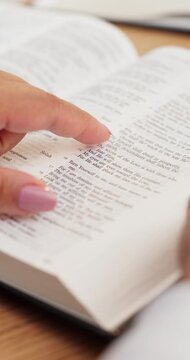 Hands, woman and reading bible in home for religious study, spiritual growth and knowledge of God. Christianity, person and Holy book with scripture guidance for worship, praise and learning faith