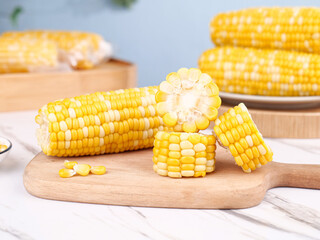 Fresh Sweet Corn Cobs Cut on Wooden Board - Golden Yellow Vegetable Food Ingredients