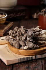 Dried Morel Mushrooms on Wooden Plate - Premium Gourmet Cooking Ingredients in Rustic Kitchen Setting