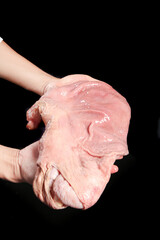 Fototapeta premium Raw Pork Belly Cut in Hands - Fresh Meat for Cooking on Black Background