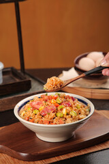 Japanese Fried Rice Bowl with Vegetables Being Served in Traditional Restaurant