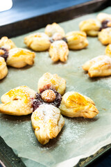 Puff pastry flower with raspberry jam filling. Baked goods. Desserts. Food concept.